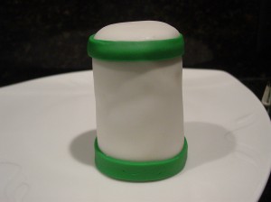 Green fondant strips on tall cupcake