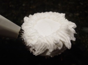Pipinng wispy frills on the bottom of the Christmas Tree Cupcake