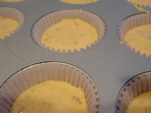 cupcake pan filled with butterfinger cupcakes batter