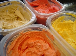 Orange,Brown,Yellow and Red Colored Icing In Containers For Turkey Cupcakes