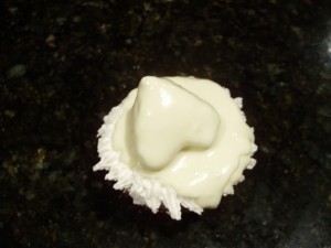 Santa cupcake dipped in white chocolate
