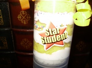 Push Pop Cake with Star Student Sticker and Ribbons on Container