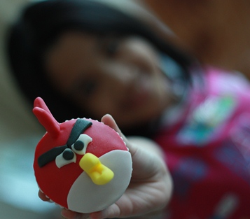Angry Bird Cupcake with Child Holding one