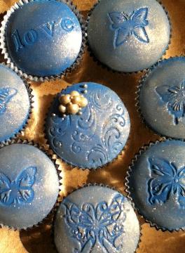 Blue Butterfly Cupcakes Iced with buttercream and fondant